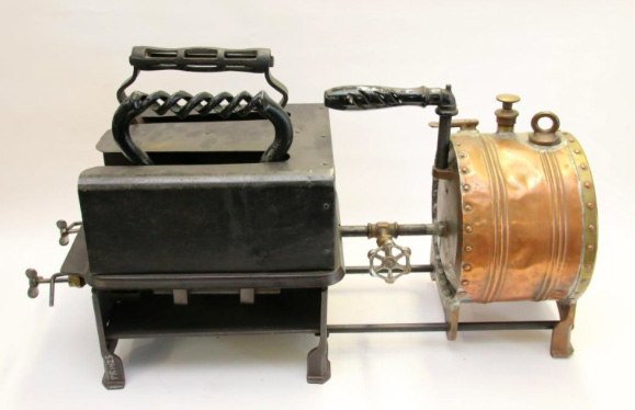 Irons museum. Collecting vintage irons. History of ironing. Музей утюга. Коллекционирование старинных утюгов. Чугунная газовая печь с медным баком для жидкого топлива, как альтернативного способа подогрева. Вмещает 2 больших утюга. Очевидно использовалась в портновских мастерских.